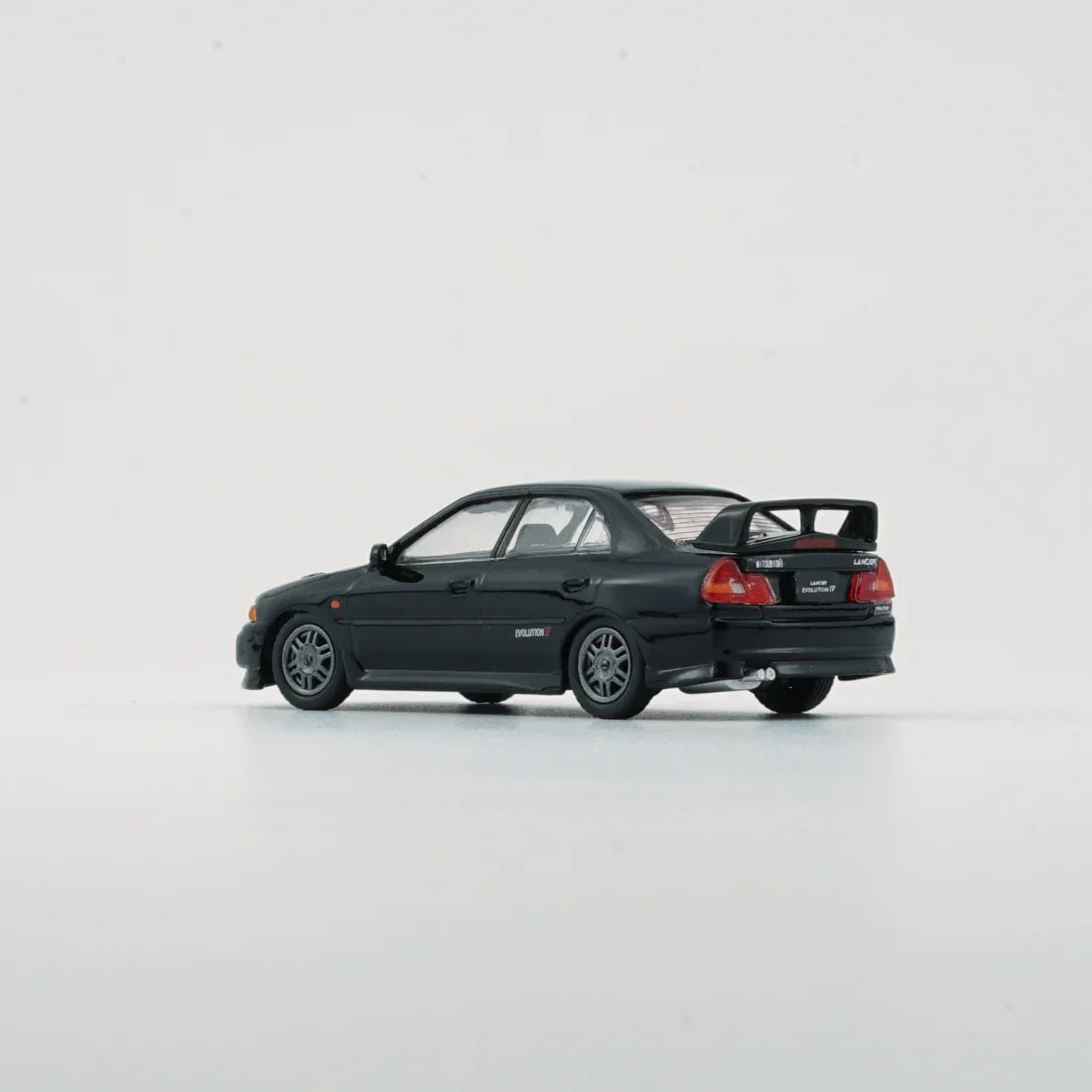 Premium scale diecast model car – Mitsubishi Lancer EVO IV, 1:64 Scale (Black) Collectible