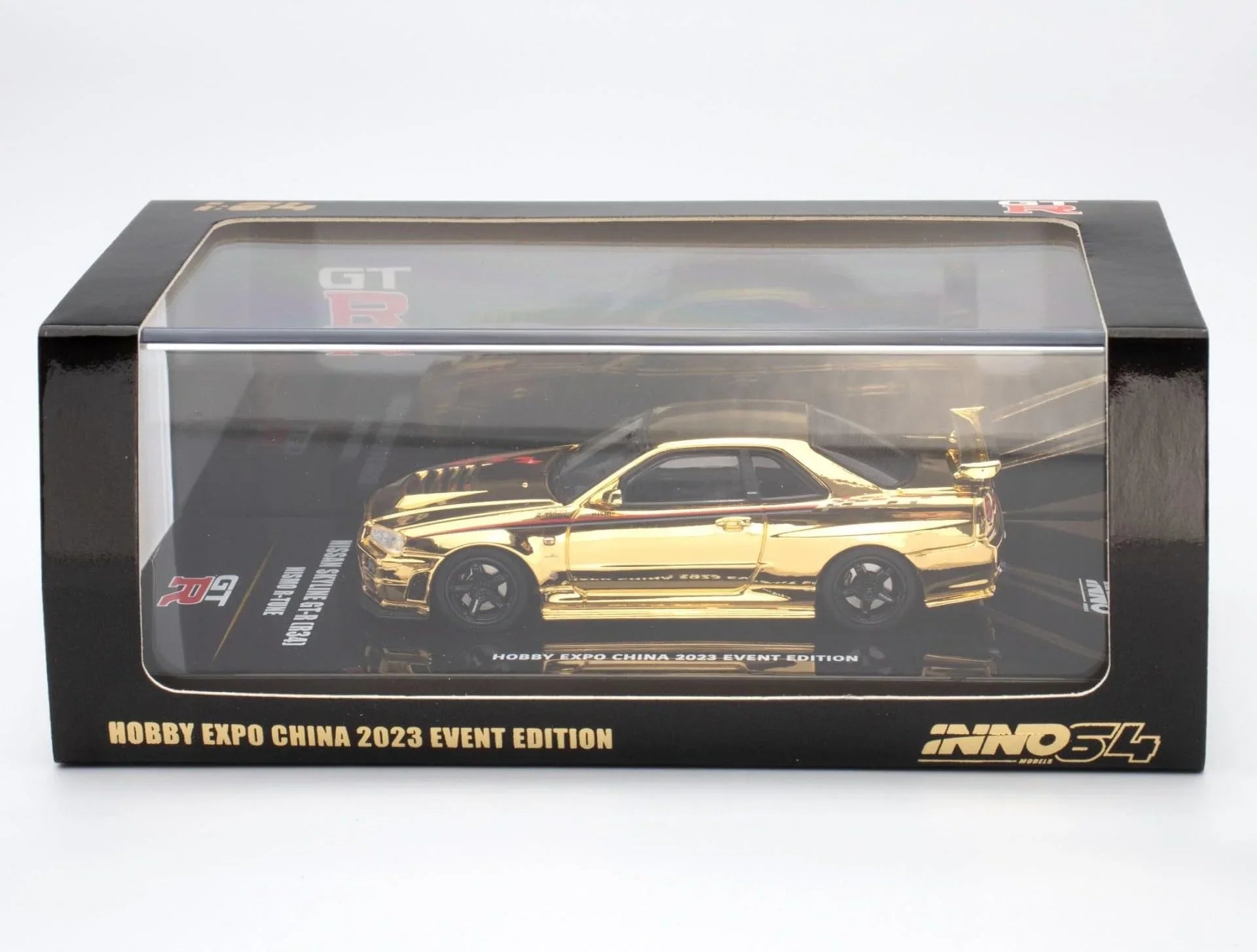 Premium scale diecast model car – *PRE-ORDER* Nissan Skyline GT-R (R34) Nismo R-Tune Gold Chrome Hobby Expo China 2023 Event Edition,1:64 Scale (Gold) Collectible
