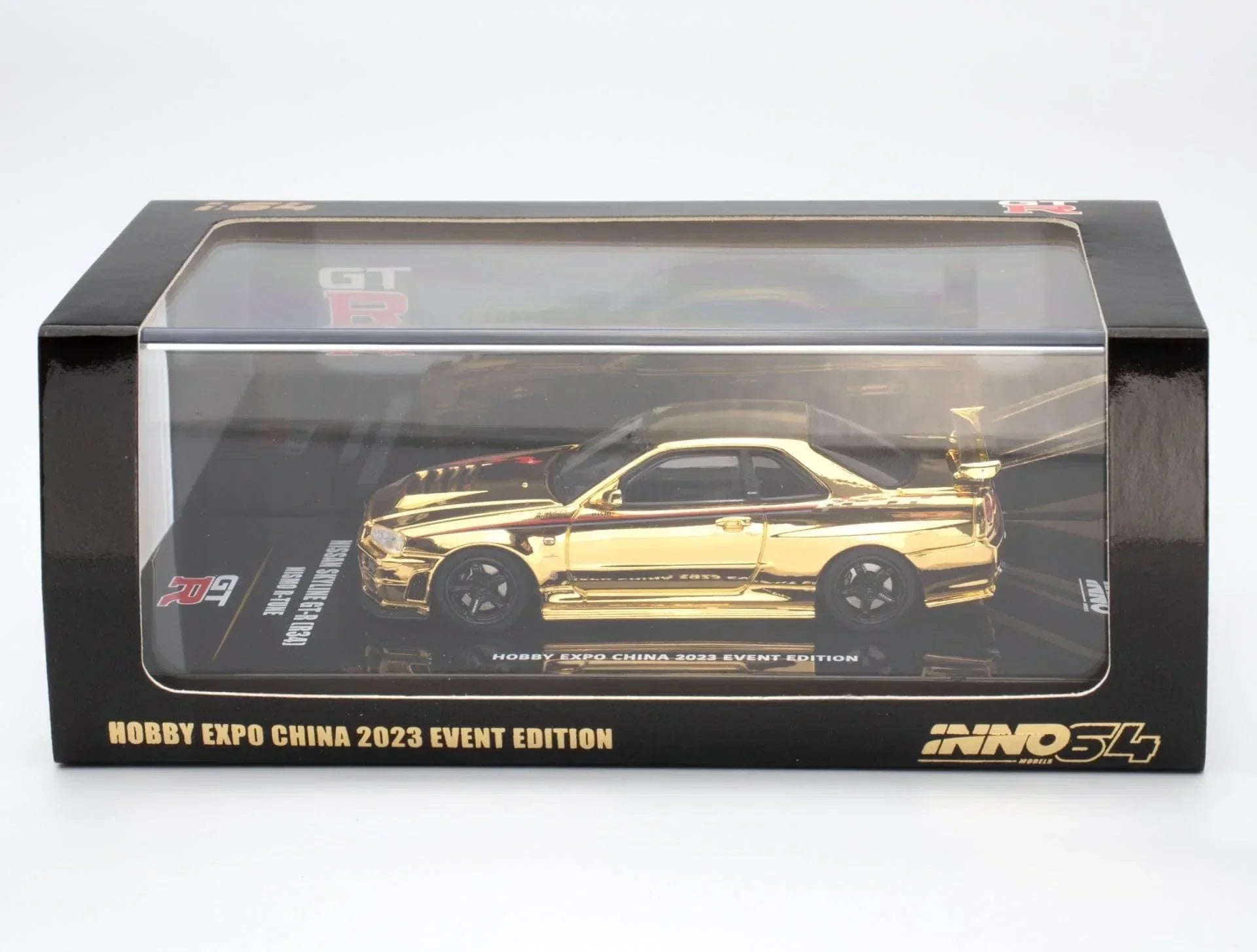 Premium scale diecast model car – *PRE-ORDER* Nissan Skyline GT-R (R34) Nismo R-Tune Gold Chrome Hobby Expo China 2023 Event Edition,1:64 Scale (Gold) Collectible