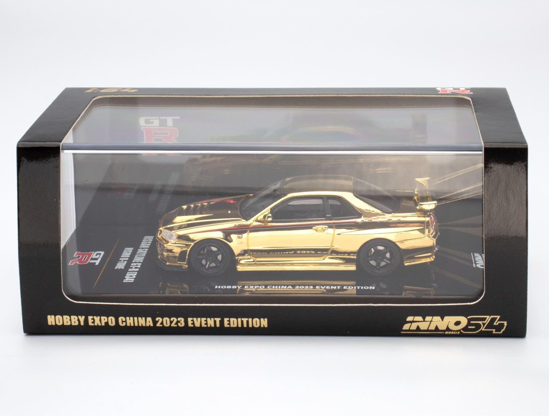 Premium scale diecast model car – *PRE-ORDER* Nissan Skyline GT-R (R34) Nismo R-Tune Gold Chrome Hobby Expo China 2023 Event Edition,1:64 Scale (Gold) Collectible