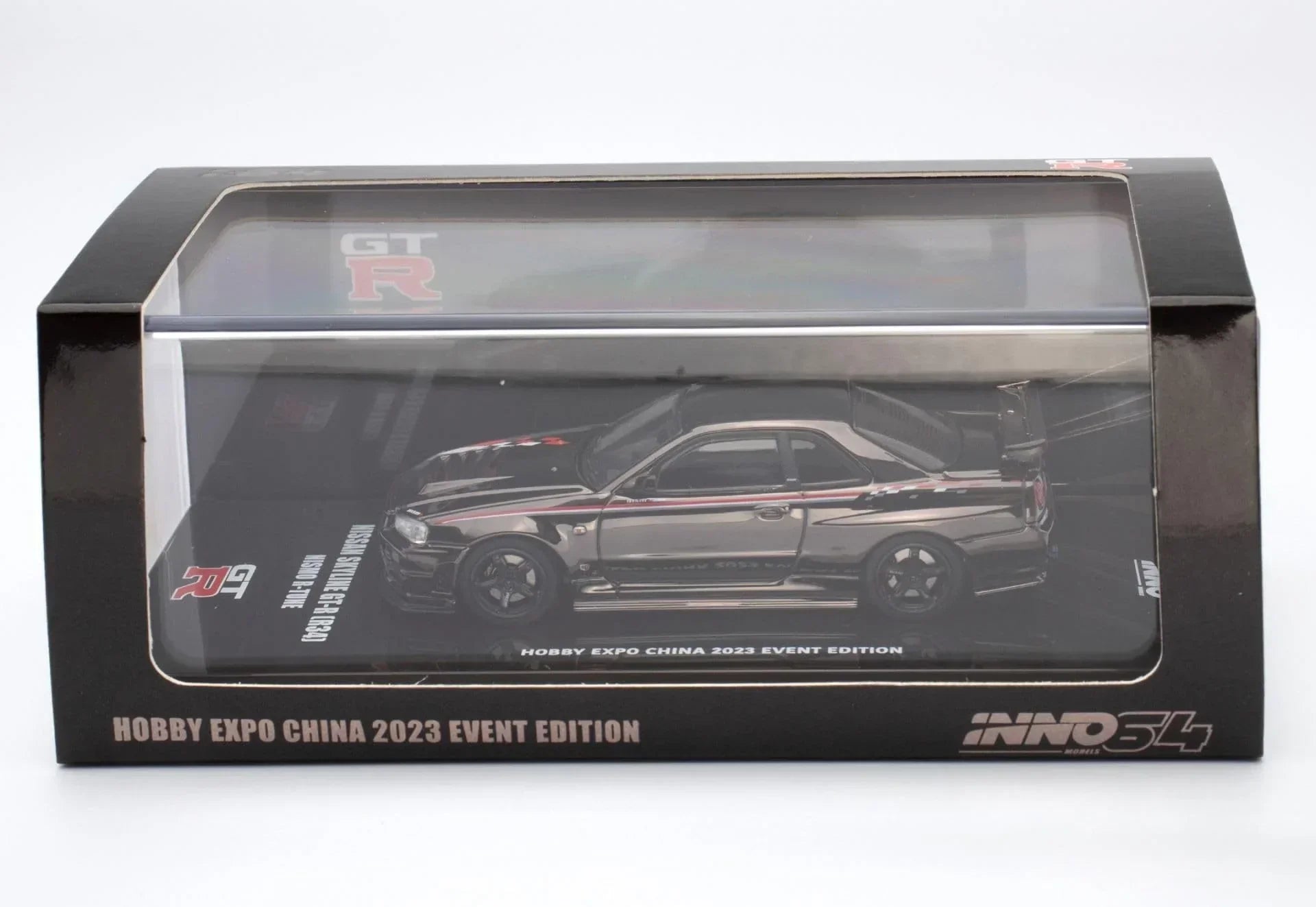 Premium scale diecast model car – *PRE-ORDER* Nissan Skyline GT-R (R34) Nismo R-Tune Black Chrome Hobby Expo China 2023 Event Edition,1:64 Scale Collectible