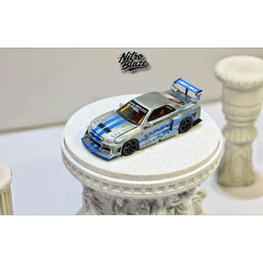 *PRE-ORDER* Nissan Skyline R34，ER34 Super Silhouette (Open-Hood, Visible Engine) Raw Silver-Blue, 1:64 Scale